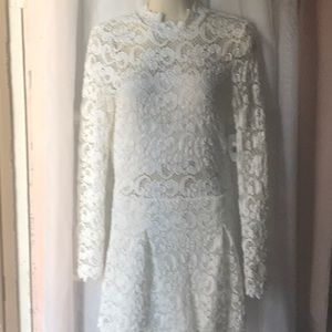 A dress/romper white lace, open back, lined shorts